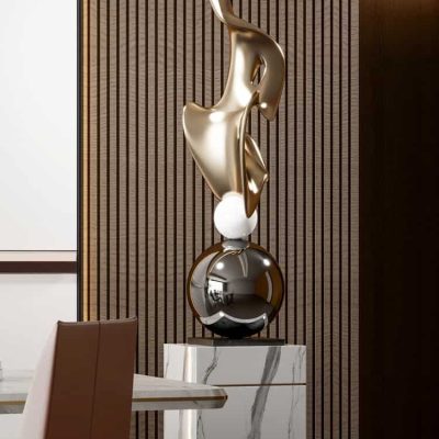 Elegant modern sculpture with gold and black finishes displayed in Monalisa Store interior. Perfect for upscale medical centers or luxury decor settings.