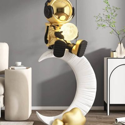 Astronaut sitting on a moon-shaped sculpture, holding a glowing moon lamp, in a modern interior space with minimalist decor, representing innovative lighting and home decor customization.