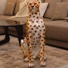 Stylish cheetah sculpture for home decor, perfect for adding wildlife art to your living room or office space, made from durable materials to enhance interior aesthetics and ambiance.