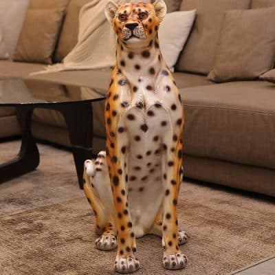 Stylish cheetah sculpture for home decor, perfect for adding wildlife art to your living room or office space, made from durable materials to enhance interior aesthetics and ambiance.