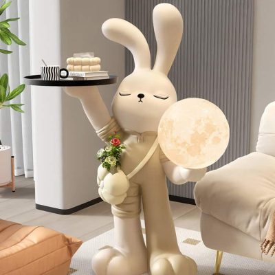 Whimsical bunny lamp sculpture holding a moon lamp, perfect for modern home decor, relaxation spaces, and cozy ambiance. Unique artistic decor piece with a cute bunny design and celestial lighting.