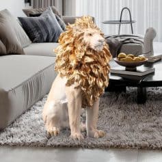 Lion plush toy with a golden mane sitting on a plush rug in a modern living room at Monalisa Store.