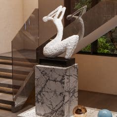 Elegant white abstract sculpture displayed inside Monalisa Store, a stylish optometry and eyewear retail location.