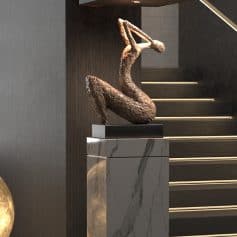 Elegant bronze sculpture of a modern abstract female figure displayed on a marble pedestal at Monalisa Store. Perfect for stylish interior decor and art lovers.