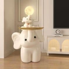 Elephant-shaped lamp with a moon and bunny decor on top, stylish and whimsical interior lighting piece for modern home decor.