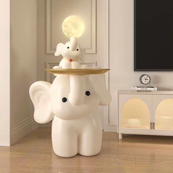 Elephant-shaped lamp with a moon and bunny decor on top, stylish and whimsical interior lighting piece for modern home decor.