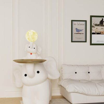 Cute elephant-themed lamp with whimsical dog figurine on top, enhancing modern interior decor for a cozy, stylish space.