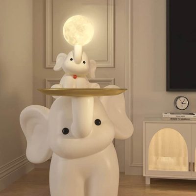 Cute elephant lamp with moon light on top, perfect for children's room decor and ambient night light.