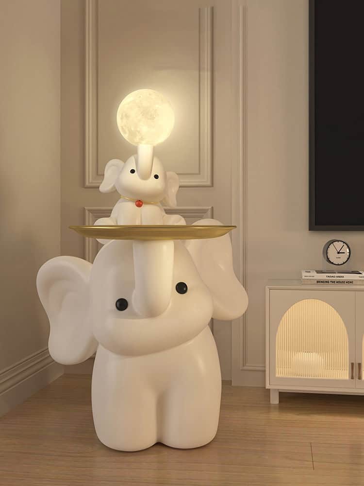 Cute elephant lamp with moon light on top, perfect for children's room decor and ambient night light.