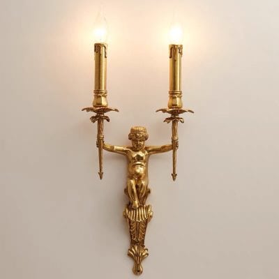 Antique gold wall sconce with a cherub figure holding two candle holders, elegant lighting fixture for luxury interior decor.