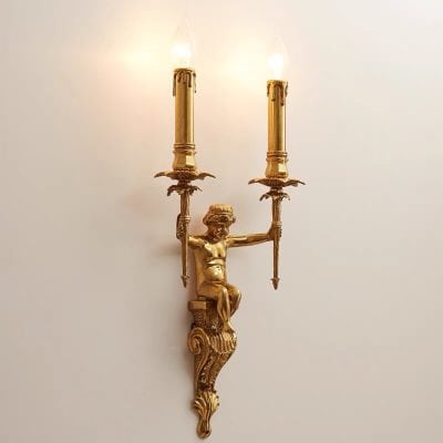 Elegant gold antique wall sconce with two candle holders, featuring intricate detailing and a classic design, ideal for sophisticated interior decor.