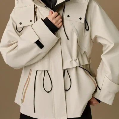 Protective winter jacket with adjustable drawstrings and multiple pockets, suitable for outdoor activities and cold weather. Stylish, functional, and designed for comfort and warmth.