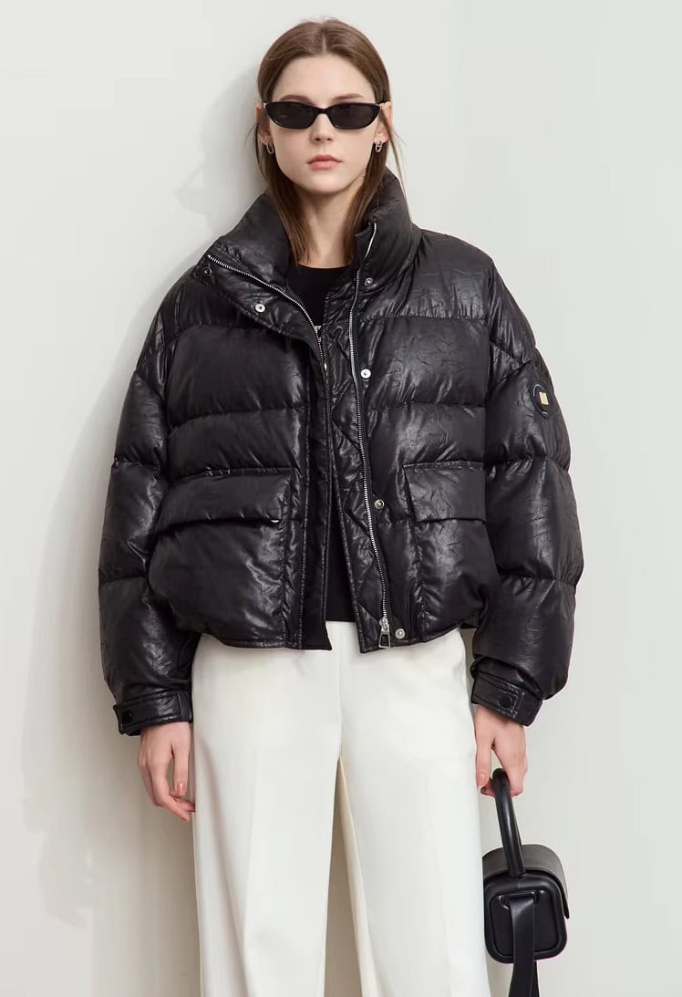 Down-filled black puffer jacket with a logo patch, stylish and warm, perfect for winter fashion from Monalisa Store.