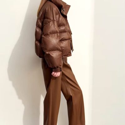 Airy brown puffer jacket, brown wide-leg pants, and oversized sunglasses in a modern Monalisa Store fashion look. Perfect for stylish winter wear or opt for trendy, warm outerwear.