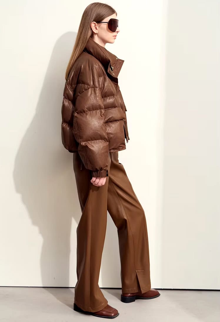 Airy brown puffer jacket, brown wide-leg pants, and oversized sunglasses in a modern Monalisa Store fashion look. Perfect for stylish winter wear or opt for trendy, warm outerwear.