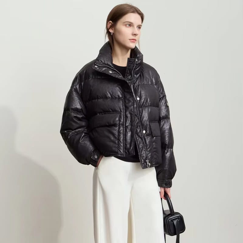 Warm black puffer jacket perfect for winter, stylish and insulated, ideal for outdoor wear and cold weather fashion.