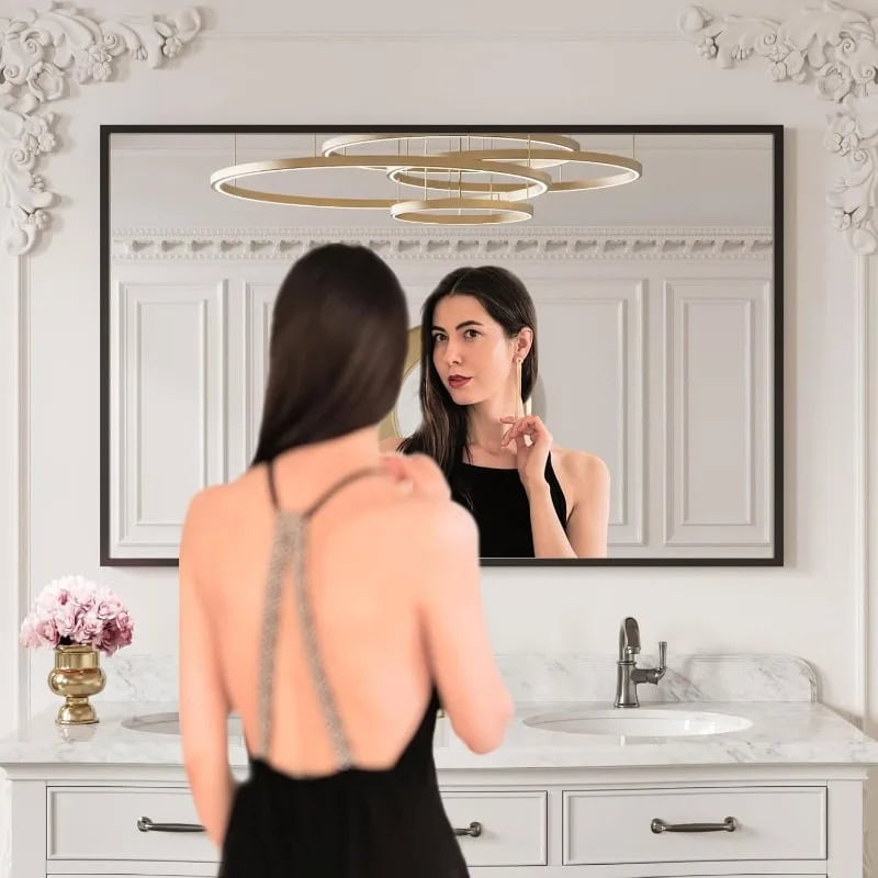 Reflection of a woman looking at herself in a mirror at Monalisa Store, focusing on eye and skincare products, modern elegant interior design, luxury beauty and optical services, stylish ambiance, health and beauty consulting.