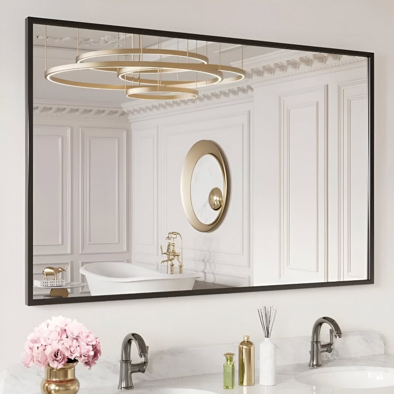 Luxurious white bathroom with elegant gold fixtures, modern circular chandelier, and decorative wall mirror, perfect for upscale interior design and luxury home decor.