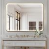 Luxurious white bathroom vanity with gold accents and large illuminated mirror in elegant modern interior. Perfect for high-end spa or optometry spa setting, emphasizing sophistication and style in eye care spaces.
