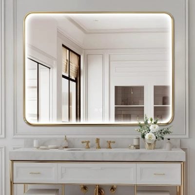 Luxurious white bathroom vanity with gold accents and large illuminated mirror in elegant modern interior. Perfect for high-end spa or optometry spa setting, emphasizing sophistication and style in eye care spaces.