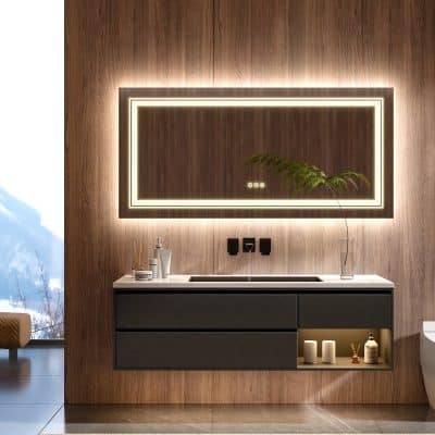 Modern bathroom vanity with sleek black cabinetry, illuminated rectangular mirror, and minimalist decor, perfect for a contemporary optometry or ophthalmology clinic setting.