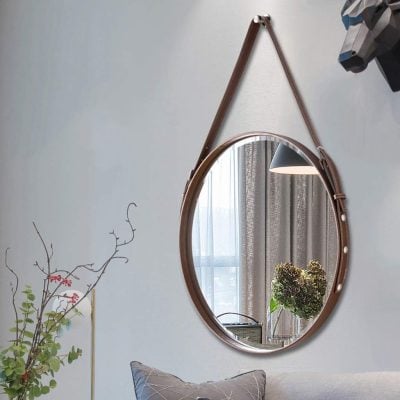 Round wall mirror with leather strap accent, stylish interior decor at Monalisa Store.