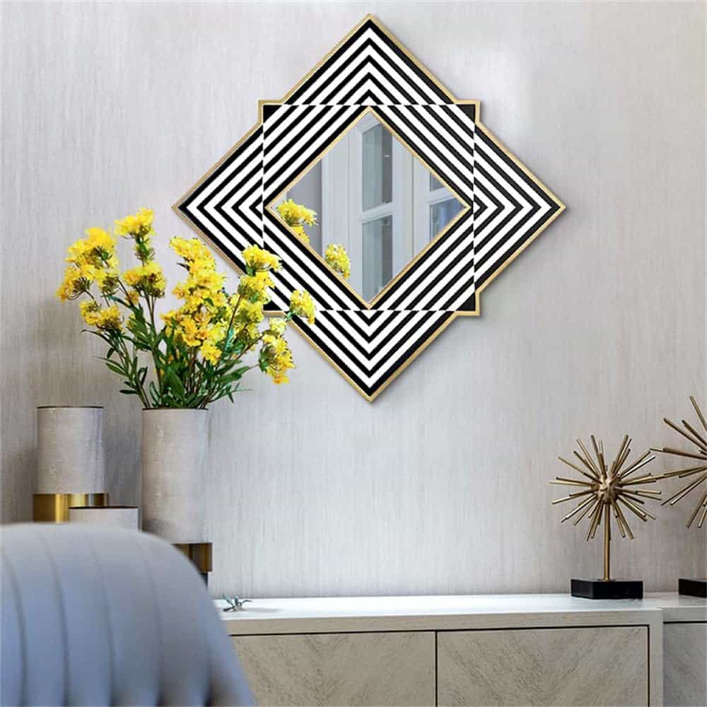 Vibrant yellow flowers in a modern living room with black and white geometric mirror decor, stylish accessories, and elegant neutral furnishings.