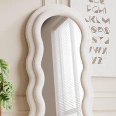 Elegant white wavy-framed mirror at Monalisa Store, perfect for modern interior decor and enhancing natural light in your beauty or skincare space.