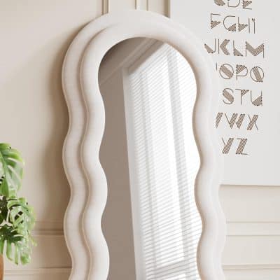 Elegant white wavy-framed mirror at Monalisa Store, perfect for modern interior decor and enhancing natural light in your beauty or skincare space.