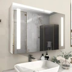 Modern bathroom vanity mirror with built-in LED lighting and marble accents for luxury home decor.
