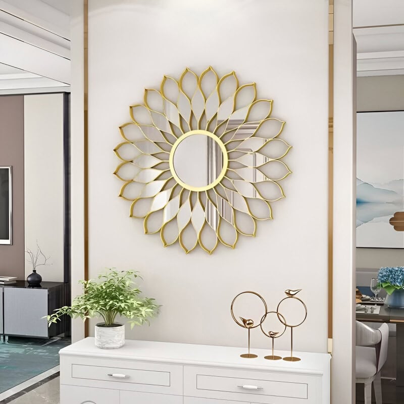 Elegant gold decorative mirror with a sunburst design for stylish home decor and interior design accents. Perfect for living rooms, bedrooms, or entryways.