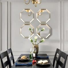 Elegant dining room wall decor with stylish octagonal mirrors and modern flower vase, enhancing interior ambiance for a sophisticated look.
