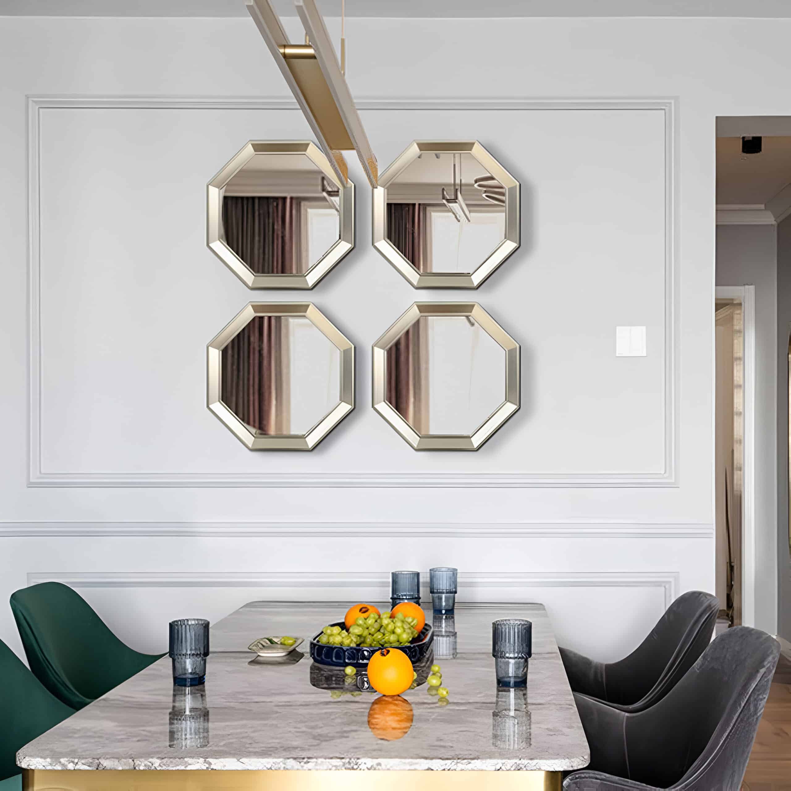 Elegant dining room with modern decor, featuring four stylish wall mirrors and a marble table set with glasses and fresh fruit, perfect for a contemporary home or upscale space.