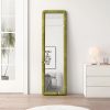 Floor-length green upholstered mirror leaning against white wall in modern bedroom setting, minimalist decor, natural light, stylish interior design, contemporary home decor, Monalisa Store opt.