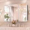 Elegant illuminated bathroom mirror with LED lights, reflecting a luxurious chandelier and stylish decor, ideal for modern vanity setups at Monalisa Medical.