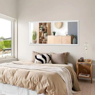 Modern bedroom with minimal decor, large window, neutral bedding, black and white accent pillow, wooden nightstand with lamp and decor, cozy and stylish interior design for a restful sleep and relaxation, Monalisa Store opt.