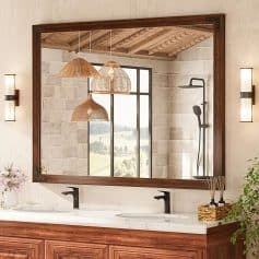 Elegant bathroom vanity with large mirror, natural wood accents, and modern black fixtures, creating a luxurious and relaxing spa-like atmosphere. Perfect for upscale home interiors.