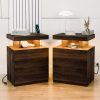 Dark wood bedside tables with modern tops featuring decorative accessories and books, creating a stylish, cozy space perfect for an optometry office or medical clinic waiting area.