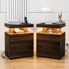 Dark wood bedside tables with modern tops featuring decorative accessories and books, creating a stylish, cozy space perfect for an optometry office or medical clinic waiting area.