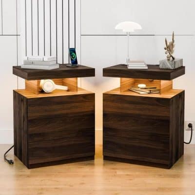 Dark wood bedside tables with modern tops featuring decorative accessories and books, creating a stylish, cozy space perfect for an optometry office or medical clinic waiting area.