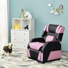 Comfortable pink and black massage armchair for relaxation in a modern nursery or children's room.
