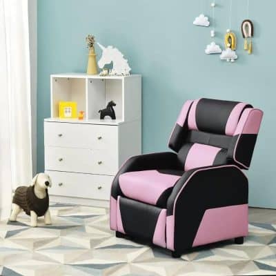 Comfortable pink and black massage armchair for relaxation in a modern nursery or children's room.