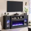 Fireplace TV stand with electric fireplace, black wooden entertainment center for living room decor, modern media console with storage, Monalisa Store home furniture design, cozy home entertainment setup.