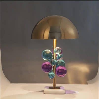 Colorful glass bubble table lamp with modern design, perfect for home décor and ambient lighting. Unique statement piece for stylish interiors.