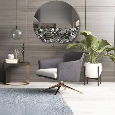 Elegant modern waiting area at Monalisa Medical Store with stylish armchair, decorative mirror, contemporary side table, and lush green plant, perfect for an inviting optometry clinic environment.