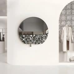 Mirror with decorative black and silver frame at Monalisa Store for stylish eyewear display.