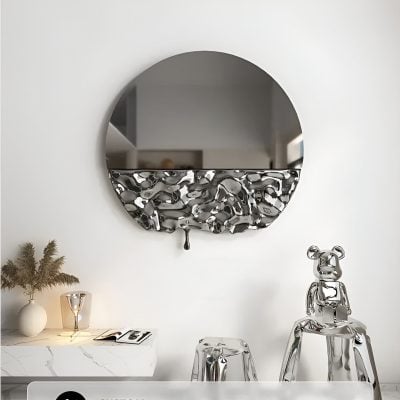 Sleek round mirror with a decorative metallic bottom accent, modern interior design, Monalisa Store, stylish home decor, contemporary aesthetic, elegant wall mirror.