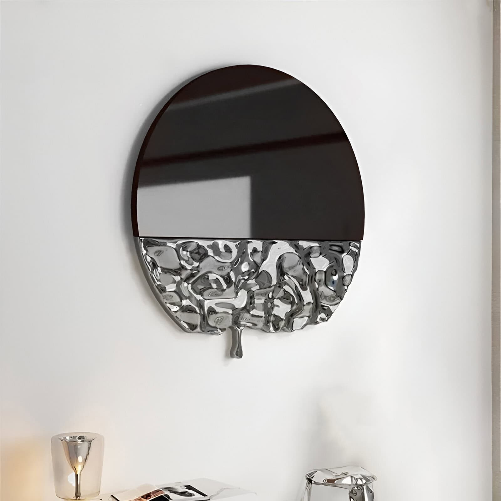 Sleek round wall mirror with a modern stainless steel sculpture design bottom half, perfect for stylish home or clinic decor, combining elegance and contemporary art.