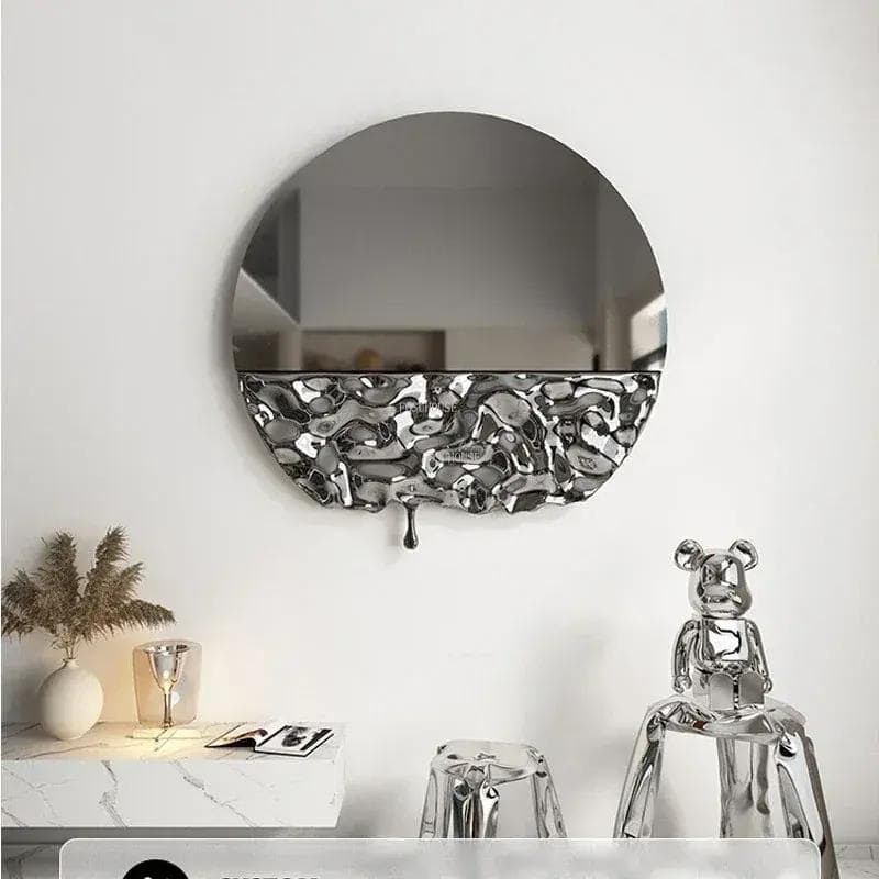 Chrome and mirror wall decor with modern abstract design, stylish home accessories, and unique artwork, featuring a metallic teddy bear sculpture and sleek decorative elements.