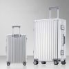 Aluminum travel suitcases with telescoping handles and 360-degree spinner wheels for durable and stylish luggage.